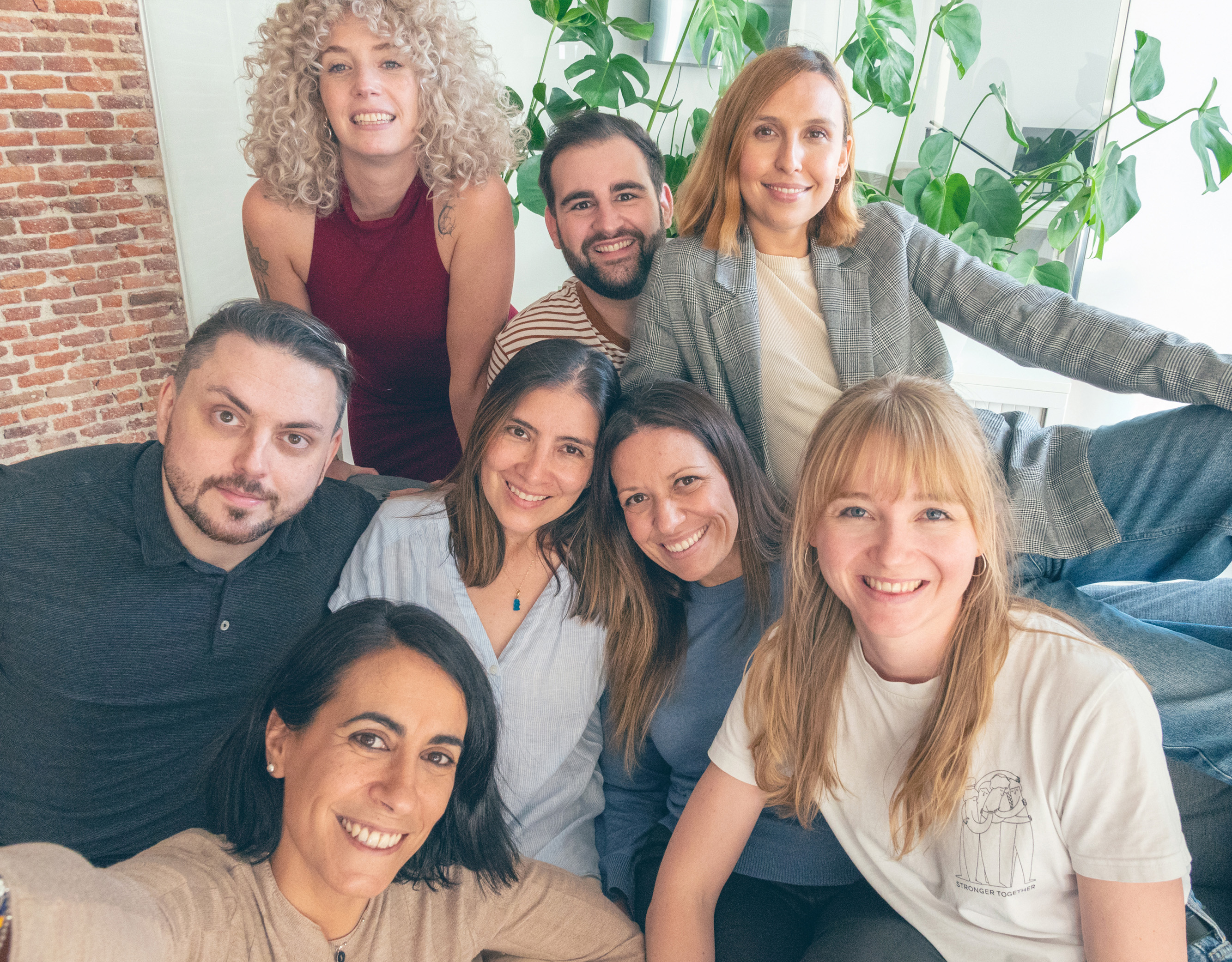 A group of Thoughtworkers with big smiles
